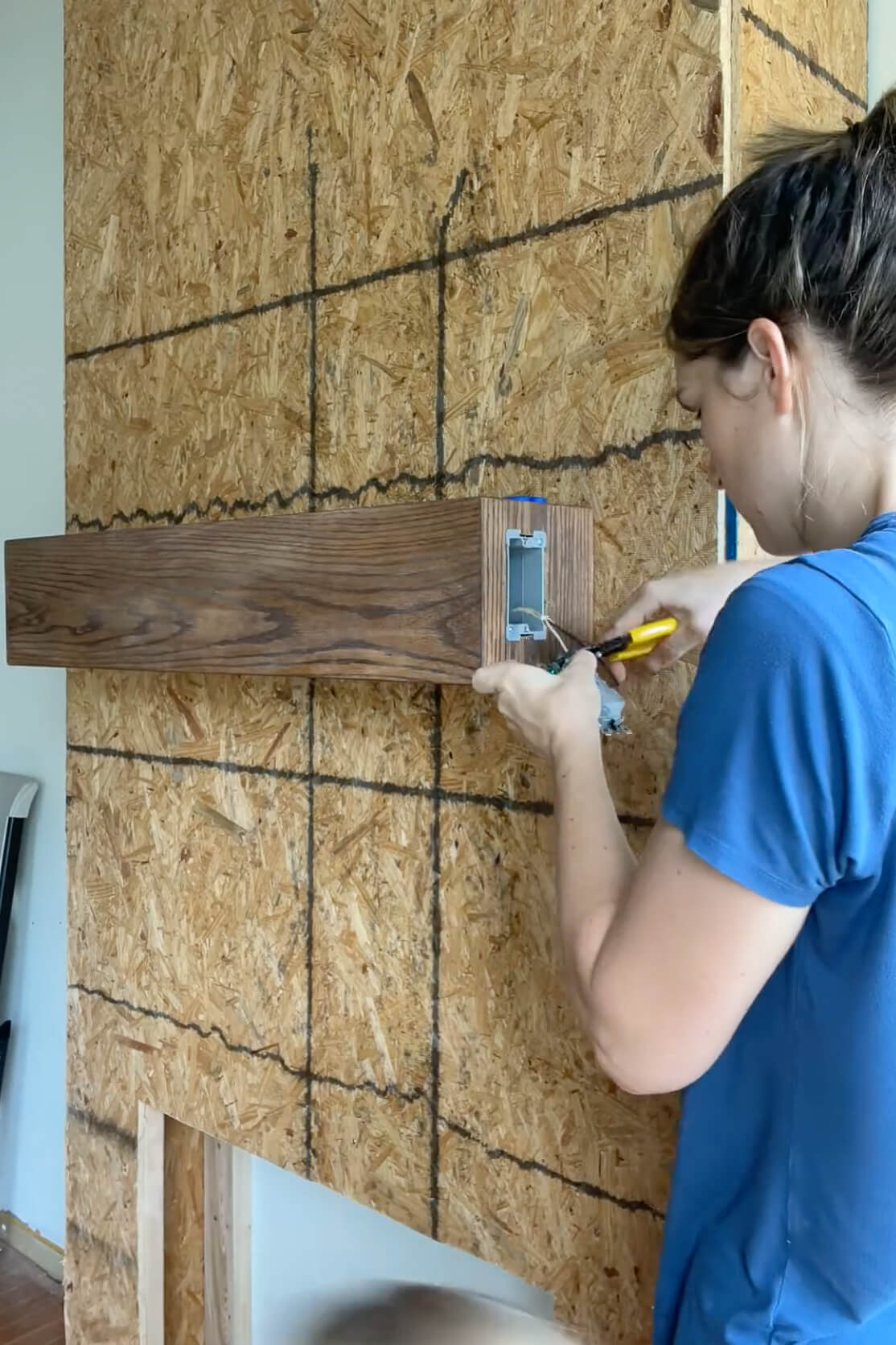 Wiring in an outlet in a fireplace mantel.